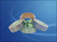 Self adhesive paper rolls for spine taping machines